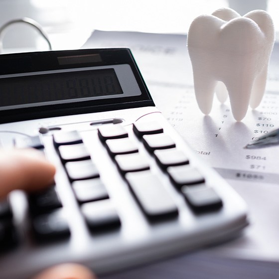 Patient in Richardson reviewing the cost of dental crown treatment