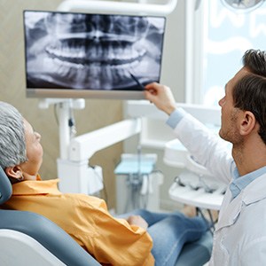 Dentist reviewing x-rays with patient