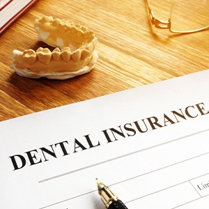 Dental insurance benefits form on table
