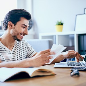 Patient in Richardson smiling after using financing to afford a dental crown