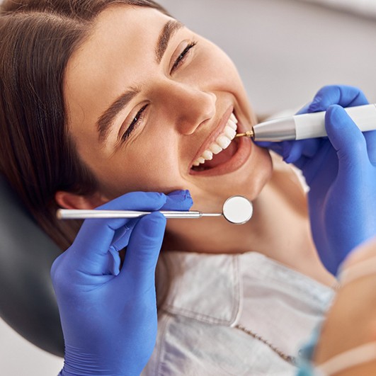 Woman smiling in the dental chair