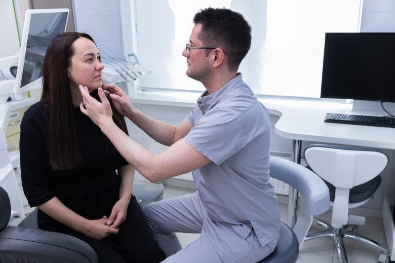 Dentist checking dental implants patient with diabetes